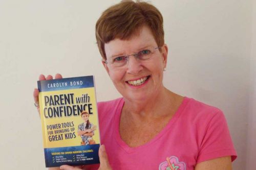 Author Carolyn Bond with her book Parent With Confidence